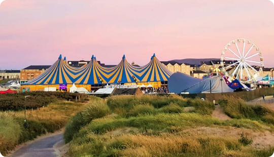 The summer sky overlooking a festival tent