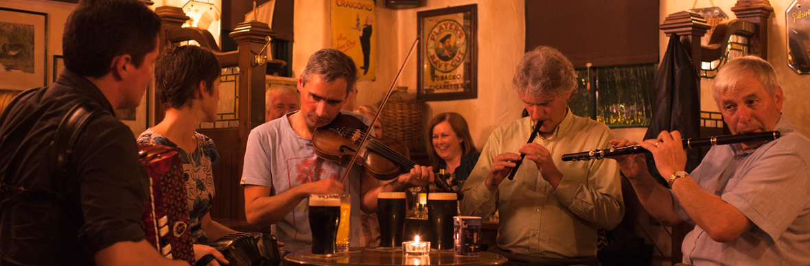A group of musicians playing in a pub